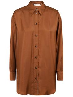 Relaxed Illustration silk shirt in Cognac BY ZIMMERMANN. Classic collar; button closure on the center front; gathered cuffs. Central rear fold detail. Relaxed Illustration, Australian Swimwear, Boho Chic Design, Shop Illustration, Brown Shirt, Full Look, Pleats Please Issey Miyake, Silk Material, Yoga Wear