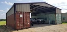 a truck parked in front of a metal building