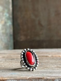 Gorgeous silver and coral Navajo ring Size 5.5 Nice condition - There are some red marks on the silver and as you can see in the photo, the setting holding the coral is slightly bent in places. Some scuffing on the stone.  Unsigned - this piece is not signed and not marked sterling.  However, it definitely looks and feels like sterling.  I just can't 100% say it is sterling as I do not have a metal tester. Navajo Ring, Navajo Rings, Red Marks, American Jewelry, Native American Jewelry, Ring Vintage, Statement Ring, Rings Statement, Olympia