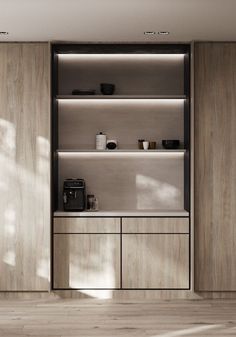 an empty kitchen with wooden cabinets and shelves