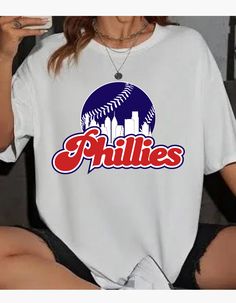 Are you in your Phillies Era? We are! Stay warm until the Phillies action heats up in this 50/50 blend soft and comfy Phillies Skyline and baseball t shirt with chenille baseball. Rock your Phillies pride wearing your red, white, and blue jawn! You'll love the cut and comfort of our sweatshirts! They are made of a 50/50 blend fleece for the ultimate in softness! All items are unisex, giving a roomy fit. Create your Cute by adding a chenille or varsity letter patch to elevate your look! Our profe Pride Wear, Varsity Letter, Baseball T, Philadelphia Phillies, Baseball T Shirt, Red White And Blue, 50 50, Baseball Tshirts, Wearable Art