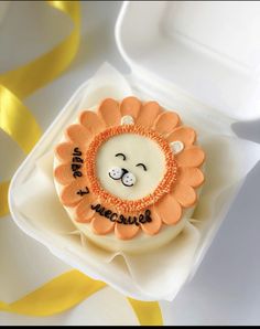 a decorated cupcake with a lion face on it