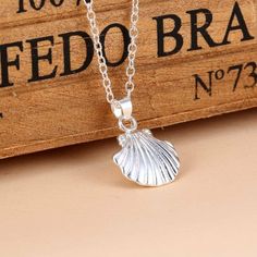 High quality silver plated scallop shell pendant The chain is 18 inches long with an additional 2 inch extension The scallop shell is .5 inches tall and wide Gift boxed because I like to make you smile :) Beach Lover Wedding Bridesmaids Camino de Santiago Pilgrim Silver Shell Necklace Perfect For Gifts, Silver Shell Necklace For Gifts, Silver Shell Necklace As A Gift, Silver Shell Necklace For Gift, Silver Shell Gift, Silver Clavicle Chain Charm Necklace For Beach, Silver Shell-shaped Necklace For Gift, Silver Shell-shaped Pendant With Lobster Clasp, Silver Shell Necklace With Lobster Clasp