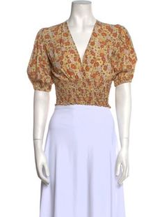 Faithfull The Brand Crop TopYellowFloral PrintRuffle EmbellishmentShort Sleeve with V-NeckFit:Tops by Faithfull The Brand typically fit true to size. Faithfull The Brand Top, Faithfull The Brand, Neck Crop Top, Print Patterns, Floral Print, Crop Top, Floral Prints, Top Outfits, Crop Tops