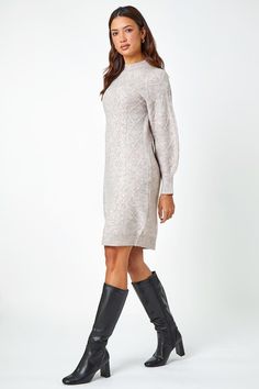 Cable Knit Jumper Stretch Dress from Roman. Embrace the cosy trend of the season with this stunning cable knit jumper dress. Cut from a soft, stretch knit fabric, this dress features a cosy high neckline and full-length sleeves with thick ribbed cuffs. Adorned in a classic cable knit texture, this piece demonstrates new season trends with ease. Designed to pull on overhead this piece is perfect with tights, biker boots and a fluffy gilet for an on-trend, everyday look! Cable Knit Jumper Dress, Knit Jumper Dress, Knitted Jumper Dress, Knit Texture, Cable Knit Jumper, Puff Sleeve Dresses, Biker Boots, Navy Dress, Stretch Dress