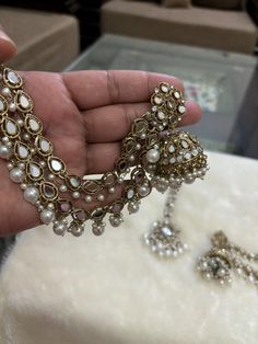 *Beautiful Premium Quality Long Earrings With Support Chain With Maangtikka *Combination Of Kundan and Monalisa Stones  *Front Side is Monalisa Stone With Kundan *Pearls And Kundan Are Of Original Quality *For More Beautiful Collection, Check At https://www.etsy.com/shop/placeoffashion *Earring Closure: Push Back *It is a Bridal or Partywear Earrings *It Will Give You a Unique and Beautiful Look  *You Can Wear This Beautiful Set At Dress or Saaree  *The Colour Combination Of This Set Is Very Uni Eid Jewelry Sets With Chandbali Latkans, Eid Jewelry Sets With Latkans And Chandbali Shape, Festive Jewelry Sets With Latkans For Eid, Kundan Jewelry Sets With Latkans For Eid, Kundan Earrings With Pearl Chain For Wedding, Pearl Chandbali Temple Jewelry Jhumkas, Pearl Chandbali Jhumkas In Temple Jewelry Style, Traditional Chandbali Earrings With Pearl Chain, Pearl Chandbali Temple Jhumkas