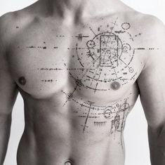 a man's chest is shown with drawings on it