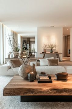 a living room filled with lots of furniture and decor on top of a wooden table