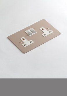 an electrical outlet cover on a white surface with one light switch and the other two