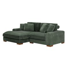 a green corded sectional sofa with pillows on the back and arms, in front of a white background