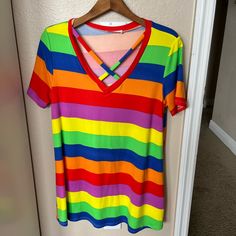 Very Colorful V Neck Long Tee. Never Worn But No Tags. Bought From Zulily. Medium But Runs Big. Would Make A Cute Early Trimester Maternity Top. Smoke Free Home. Colorful Cotton V-neck Tops, Multicolor V-neck T-shirt For Vacation, Multicolor Rainbow Print Tops For Spring, Striped Rainbow Print T-shirt For Spring, Spring Striped T-shirt With Rainbow Print, Casual Green Tops With Rainbow Print, Fun Cotton V-neck Top, Vibrant Stretch Summer Tops, Fitted Multicolor V-neck T-shirt