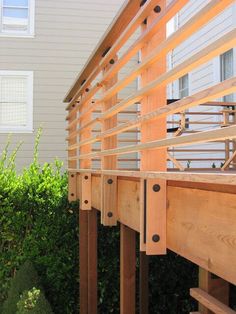 a close up of a wooden rail on a house