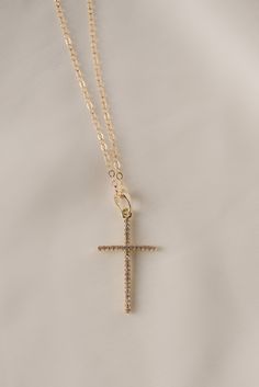 Our popular vertical cross pendant is a subtle statement to add sparkle to any look. split 18k gold-filled vertical cross pendant + CZ accent stones Your choice of chain length (16", 18", or 20") All materials are lead & nickel free Handmade with love by Luna & Jade in the U.S. Cheap Adjustable Cross Pendant Necklace, Luxury Clavicle Chain With Cross Pendant, Affordable Stainless Steel Cross Pendant Necklace, Cheap Yellow Gold Cross Necklace, 14k Gold Filled Cross Pendant Jewelry With Adjustable Chain, 14k Gold Filled Cross Pendant Necklace, 14k Gold-filled Gold Cross Pendant Necklace, Gold Cross Pendant Necklace In 14k Gold Filled, 14k Gold Filled Gold Cross Necklace