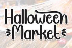 the words halloween market written in black ink