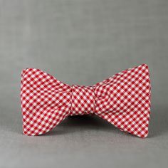 A totally classic mini gingham in red & white.  -Unisex adult sized.  Classic thistle shape.  Adjustable neck: 14-18 inches -100% cotton.  Repurposed from a dress shirt.  Hand wash, hang dry, warm iron. -Freestyle/Self tie.  Tie it yourself for mega style points.   -Ready to ship: ships via USPS first class within 24 hours (expedited shipping available at checkout). xoelle bow ties are handmade with love in Hawaii, USA from second hand and vintage items. Classic Summer Ties As Gifts, Classic Red Ties For Summer, Summer Dapper Bow Tie, Classic White Bow Tie For Spring, Classic Spring Bow Ties, Classic Spring Bow Tie, White Dapper Bow Tie For Summer, Red Summer Bow Tie, Bow Tie For Men