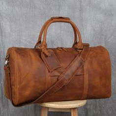 Large Leather Duffle bag With Trolley Sleeve Classic Large Capacity Duffle Bag For Trip, Classic Satchel Travel Bag With Large Capacity, Classic Large Capacity Satchel Travel Bag, Classic Large Capacity Satchel For Trip, Classic Weekender Bag With Large Capacity For Trips, Classic Large Capacity Weekender Bag For Trips, Vintage Large Capacity Travel Bag For Business, Classic Large Capacity Duffle Bag For Daily Use, Vintage Business Travel Bag With Large Capacity