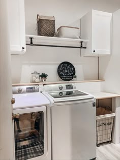 a white washer and dryer in a small room