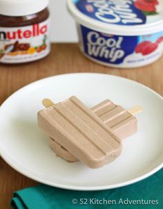 an ice cream popsicle sitting on top of a white plate