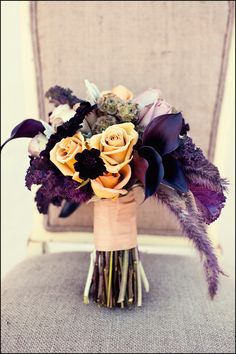 a bouquet of flowers sitting on top of a chair