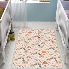 a baby's room with two cribs and a rug on the floor