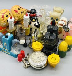 an assortment of toys and other items on a white surface with no people around them