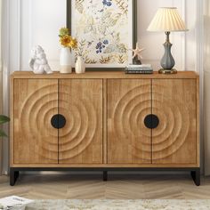 a wooden cabinet with two black circles on it