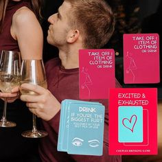 a man and woman holding wine glasses in front of signs that say, take off it's clothes