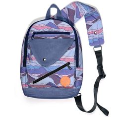 a blue and pink backpack with an orange patch on the front, two black straps hanging from it