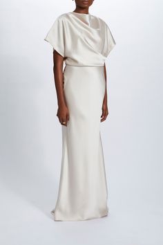 Fluid Satin relaxed drape gown. Shown in Champagne. It is possible to have this style Made to Order in any of our standard Fluid Satin colors, please reach out to customerservice@amsale.com to place an order. Drape Gown, Champagne Gown, Amsale Dress, Peplum Gown, Ivory Bridesmaid Dresses, Draped Gown, Drape Gowns, Chiffon Midi Dress, Maxi Gown