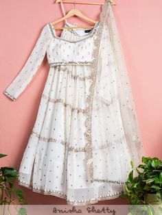 A three-piece Ivory mirror lehenga set from the Anisha Shetty collection. This beautiful ivory mirror georgette lehenga set is paired with an ivory embroidered mirror blouse. The lehenga set is enhanced with abla embroidery work. And the blouse has a pearl-bead tassel tie-up at the back. This outfit is completed with an ivory net dupatta with heavy mirror scalloped edging. Sparkle Lehenga, Mirror Lehenga, Chikankari Anarkali, Chikankari Lehenga, Gold Lehenga, Bridesmaid Lehenga, Lehenga Dupatta, Georgette Lehenga, Georgette Dupatta