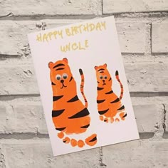 a happy birthday card with an image of two tigers on one side and the words, happy birthday uncle