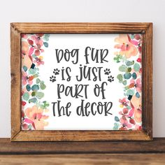 a dog is just part of the decor framed in a wooden frame on a shelf