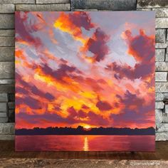 a painting of a sunset over the ocean with clouds in the sky and water below