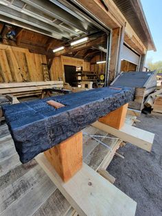 a table that has been made out of wood and is sitting in the middle of a building