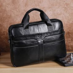 Style: Business Item Width: 3.14inch Item Type: Briefcases Item Length: 15.75inch Item Height: 11.81inch Handle/Strap Type: Soft Handle Genuine Leather Type: Cow Leather Exterior: Flap Pocket Closure Type: Zipper Business Travel Bag, Laptop Bag Men, Work Handbag, Leather Briefcase Men, Cowhide Bag, Laptop Briefcase, Leather Laptop Bag, Briefcase For Men, Leather Laptop