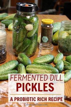 pickles and spices on a wooden table with the title fermented dill pickles