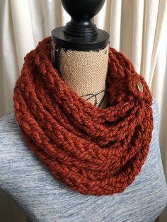 This beautiful burnt orange scarf is so warm and cozy, you won't want to take it off. The rich color of this scarf will be the perfect accent for any outfit. You don't have to worry about feeling itchy because the yarn is very soft and can be worn with a collarless top without feeling scratchy! Perfect for a dressy or casual look.  Since this scarf is one long strand that's wrapped around several times, I've secured it with a removable cuff to ensure you don't have to fuss with the many layers that create this beautiful look. However, because the cuff is removable, you'll be able to change the way it's layered, if you like.  Your choice of cuff material. ✦ Perfect gift for you or someone else. Mother's Day, thank you gift, graduation, birthday, etc. ✦ 80% acrylic, 20% wool ✦ Since I make t Soft Knit Infinity Scarf For Fall, Soft Knit One Size Infinity Scarf For Fall, Fall Infinity Scarf In Soft Knit, Casual Orange Scarves For Fall, Casual Orange Scarf For Fall, Knit Infinity Scarf For Fall, Cozy Chunky Knit Fall Scarves, Chunky Knit Casual Scarves For Fall, Cozy Chunky Knit Scarves For Fall