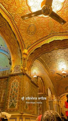 an ornately decorated ceiling in the interior of a building