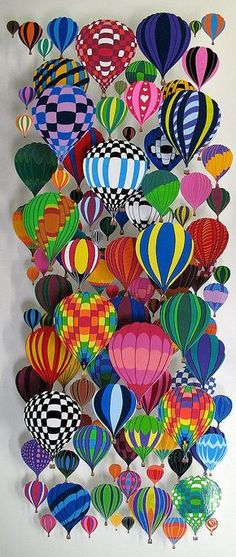 colorful hot air balloons are hanging on the wall