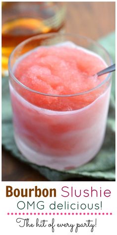 a small glass filled with watermelon slushie on top of a green napkin