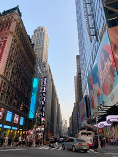 a busy city street filled with tall buildings