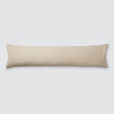 a white pillow on a gray background