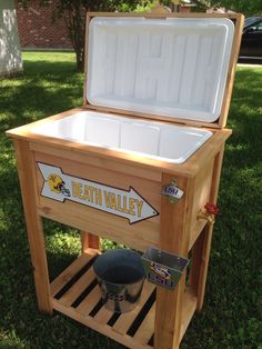 an ice chest is sitting in the grass