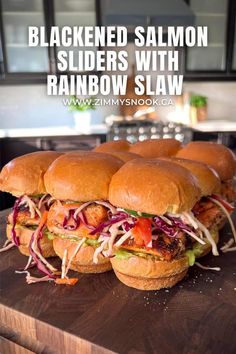 three sandwiches stacked on top of each other with the words, blackened salmon sliders with rainbow slaw