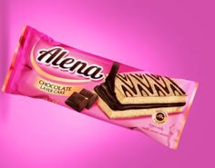 a pink chocolate bar with zebra print on it's wrapper, against a purple background