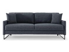 a gray couch with two pillows on it's back and one arm facing the camera