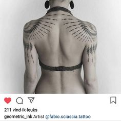 the back of a woman's neck with tattoos on her upper and lower part