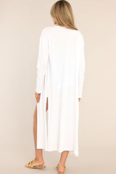 How long is your to-do list today? It sounds a little tedious. If you need some motivation, I've got Just What You Need! Layer your outfit with this essential long white cardigan. Now you're ready to go! This cardigan features a long flowy fit with two slits on the side. 50% Polyester, 50% Cotton Unlined Imported Hand Wash Cold Model is wearing a size small. Long White Cardigan, Sorority Rush Dresses, Rush Dresses, Cardigan Crop Top, Cardigan Crop, Red Dress Boutique, Dress Bra, Friend Outfits, Long Crop Top