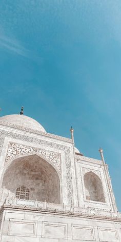 the view from below of an ornate white building