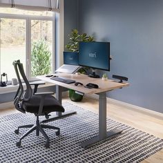 a computer desk with two monitors on it